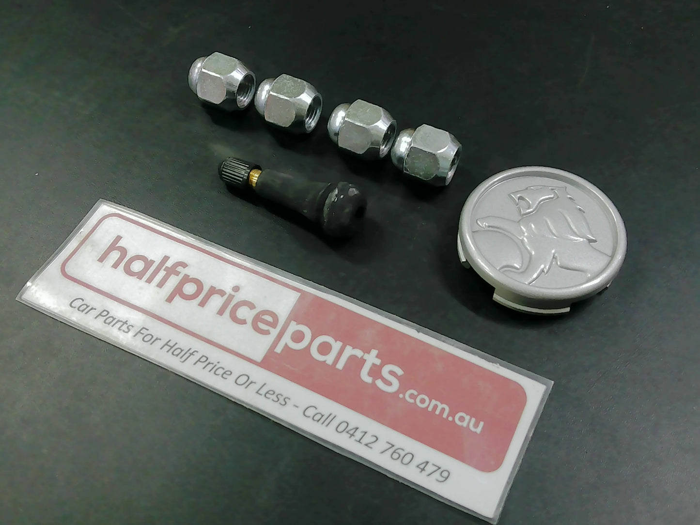 Holden YG Cruze Genuine Alloy Centre Cap/Valve And Wheel Nuts New Part