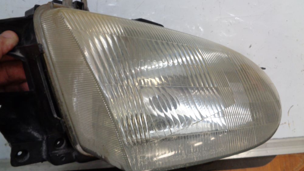 Ford Festiva WD-WF Genuine drivers headlight USED VGC