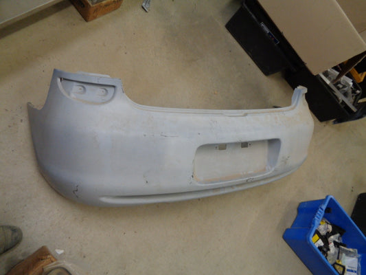 Mazda 323 Astina Genuine Rear Bumper Cover New Part