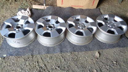 Nissan Navara D40T Genuine set 4 alloy rims 2 with caps Used part