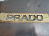 Toyota 120 Series Prado Genuine Rear PRADO Emblem New Part