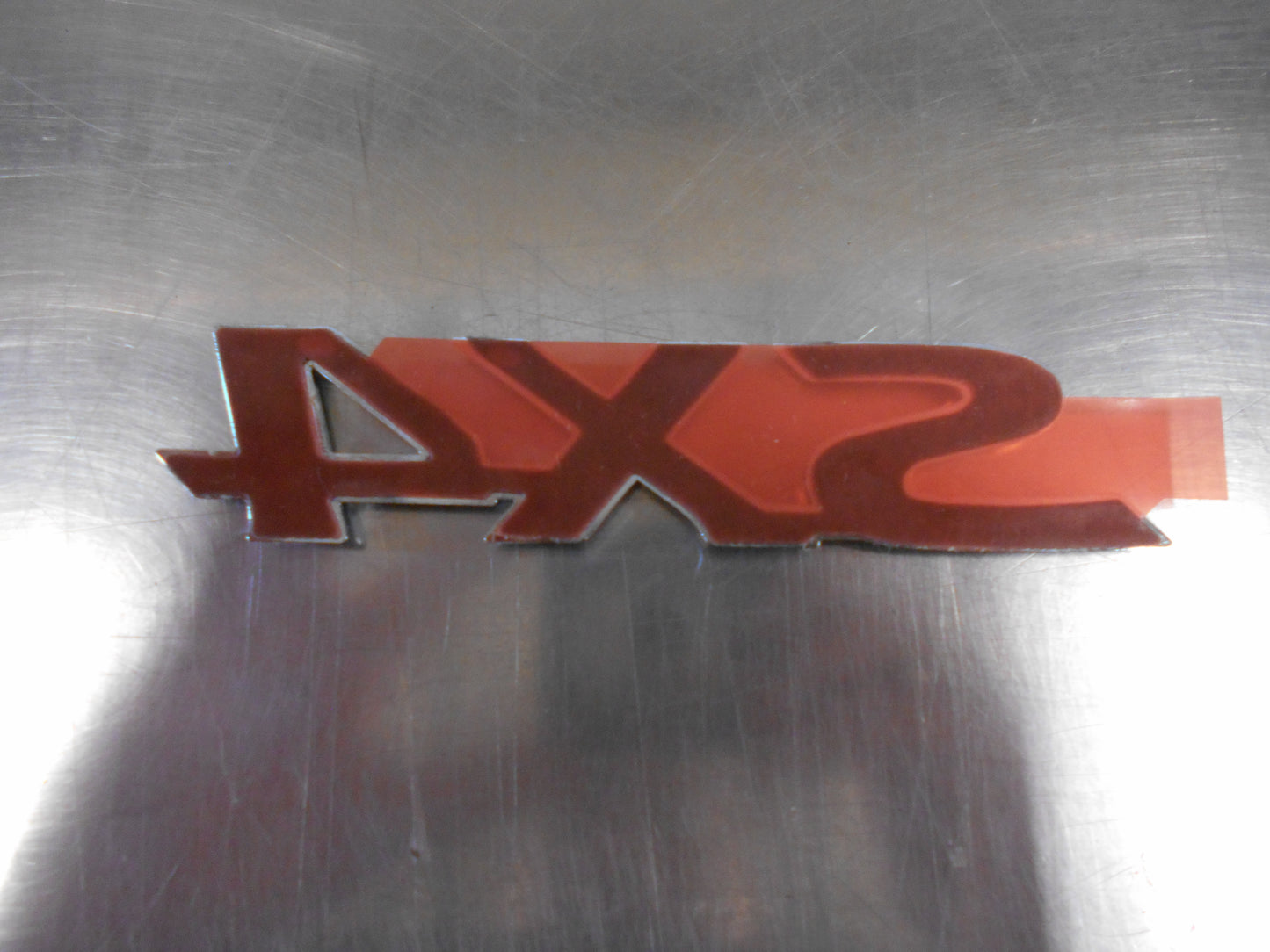 Suzuki SX4 Genuine Emblem Nameplate New Part