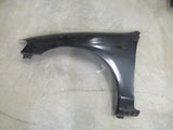 Mazda 323 Protege Genuine Left Hand Front Guard New Part.