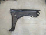 Mazda 323 Protege Genuine Left Hand Front Guard New Part.