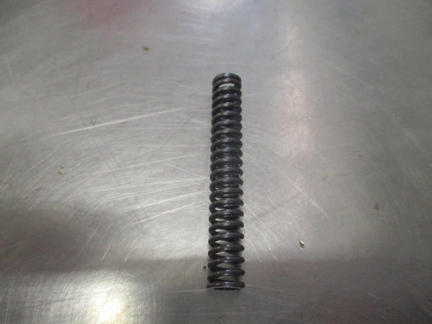 Nissan Pathfinder Genuine Striking Arm Check Spring New Part