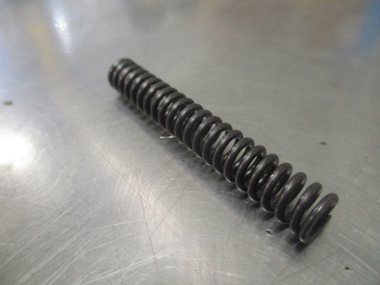 Nissan Pathfinder Genuine Striking Arm Check Spring New Part