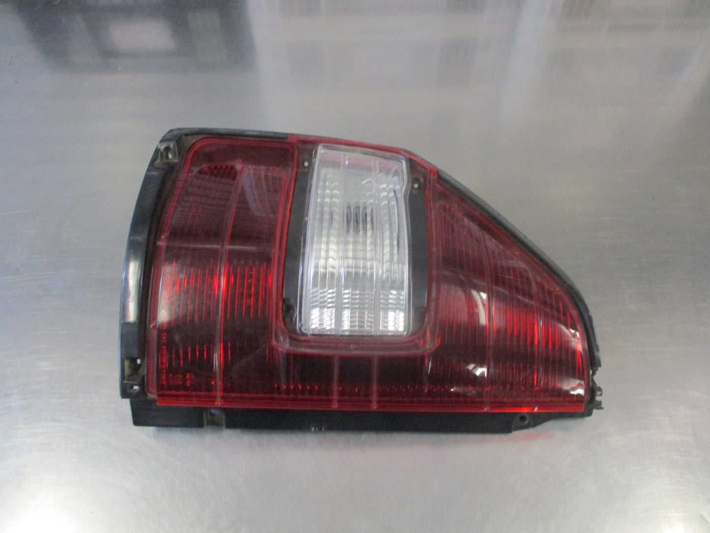 Mitsubishi Pajero Genuine Left Hand Tail Light New Part Slightly Cracked
